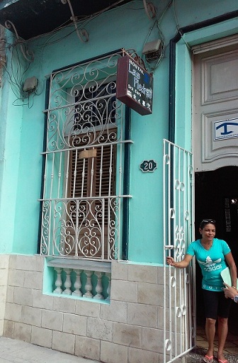 'Anfitriona y frente de la casa' Casas particulares are an alternative to hotels in Cuba.